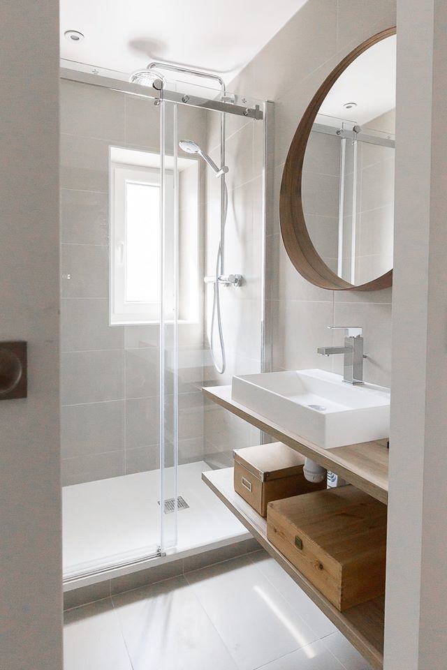 Design ideas for a small contemporary 3/4 bathroom in Paris with open cabinets, beige cabinets, a curbless shower, a two-piece toilet, gray tile, stone tile, grey walls, ceramic floors, a console sink, wood benchtops, grey floor, a sliding shower screen and beige benchtops.
