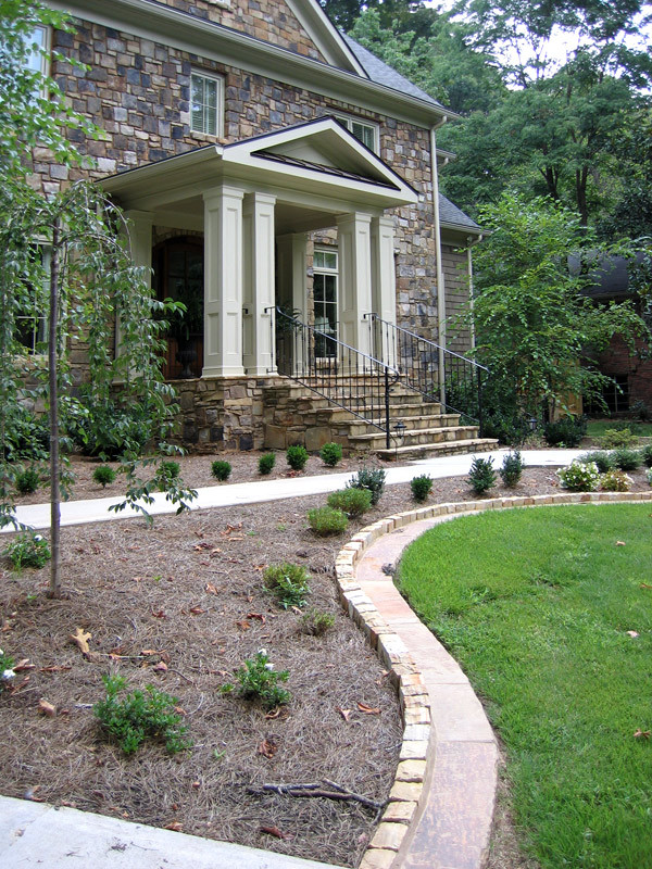 Inspiration for a mid-sized traditional exterior in Atlanta with mixed siding.