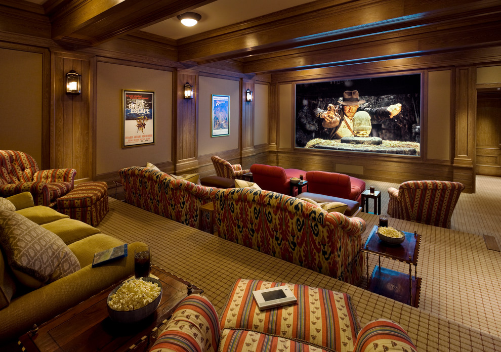 Inspiration for a mid-sized traditional open concept home theatre with brown walls, carpet and a built-in media wall.