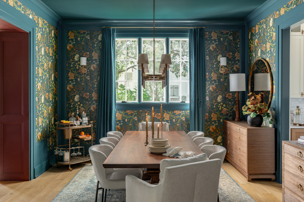 Inspiration for a large transitional medium tone wood floor and wallpaper enclosed dining room remodel in DC Metro with green walls