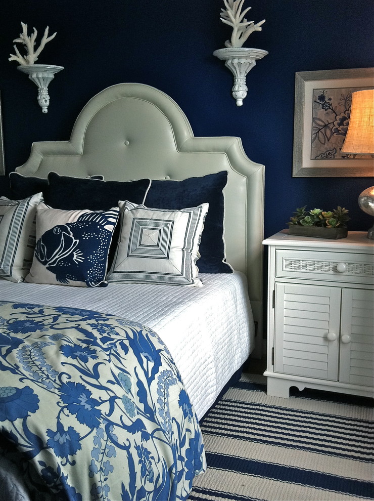 Inspiration for a beach style bedroom in Dallas with blue walls.