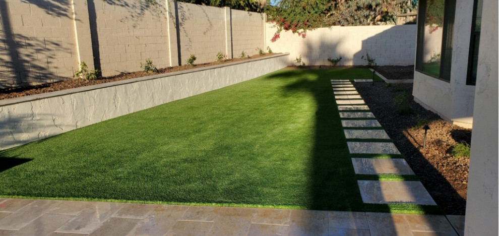 This is an example of a contemporary backyard concrete paver landscaping.