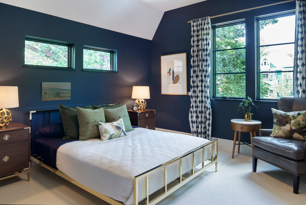 This is an example of a mid-sized transitional guest bedroom in Minneapolis with blue walls and carpet.