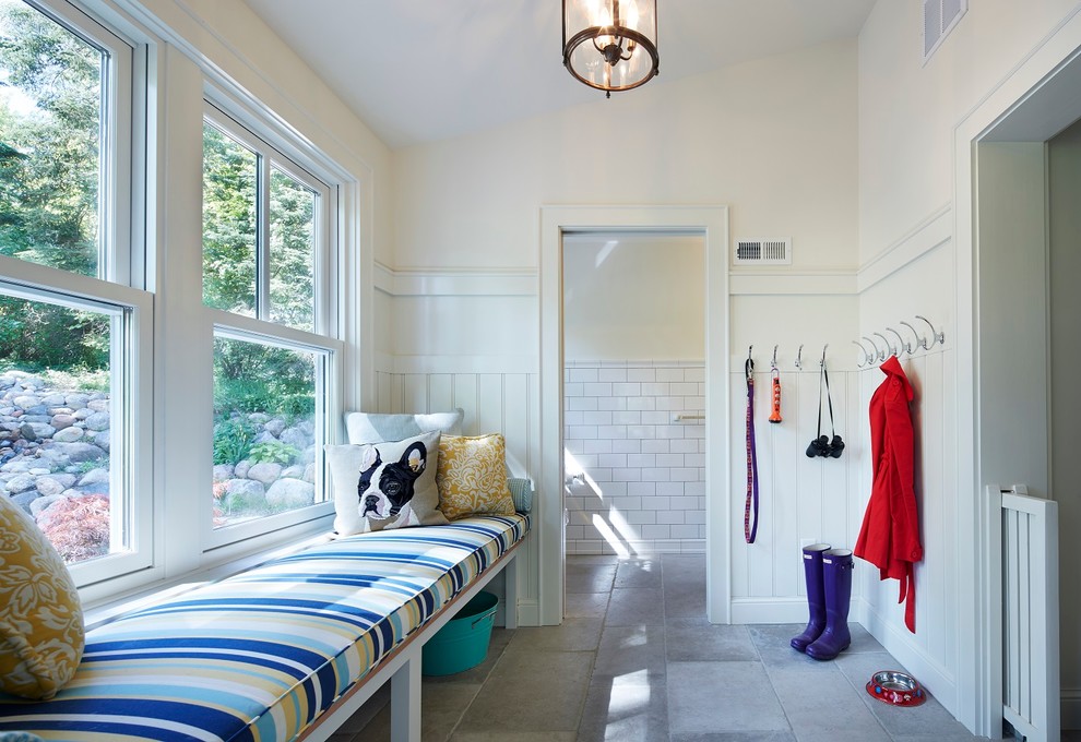 Inspiration for a mid-sized traditional mudroom in Minneapolis with white walls, limestone floors and a single front door.
