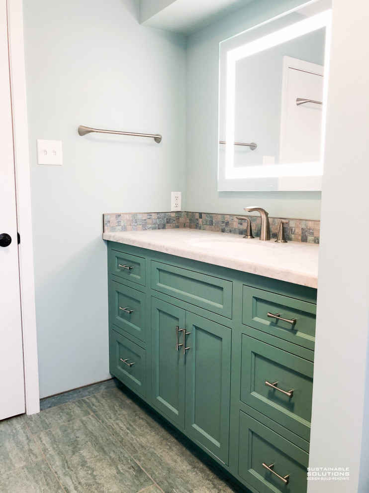 Bathroom - small transitional single-sink bathroom idea with recessed-panel cabinets, blue cabinets, blue walls and a built-in vanity