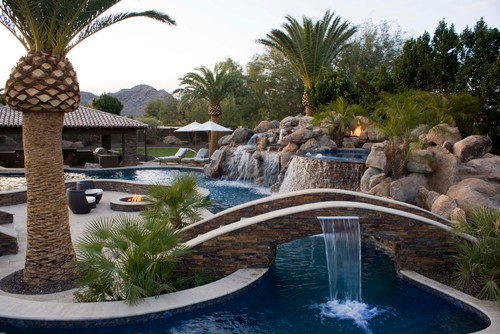 If you create a long and narrow pool that wraps around seating areas, it can act more like a river. This gives the park a more natural appeal and lets your water encompass the area nicely.