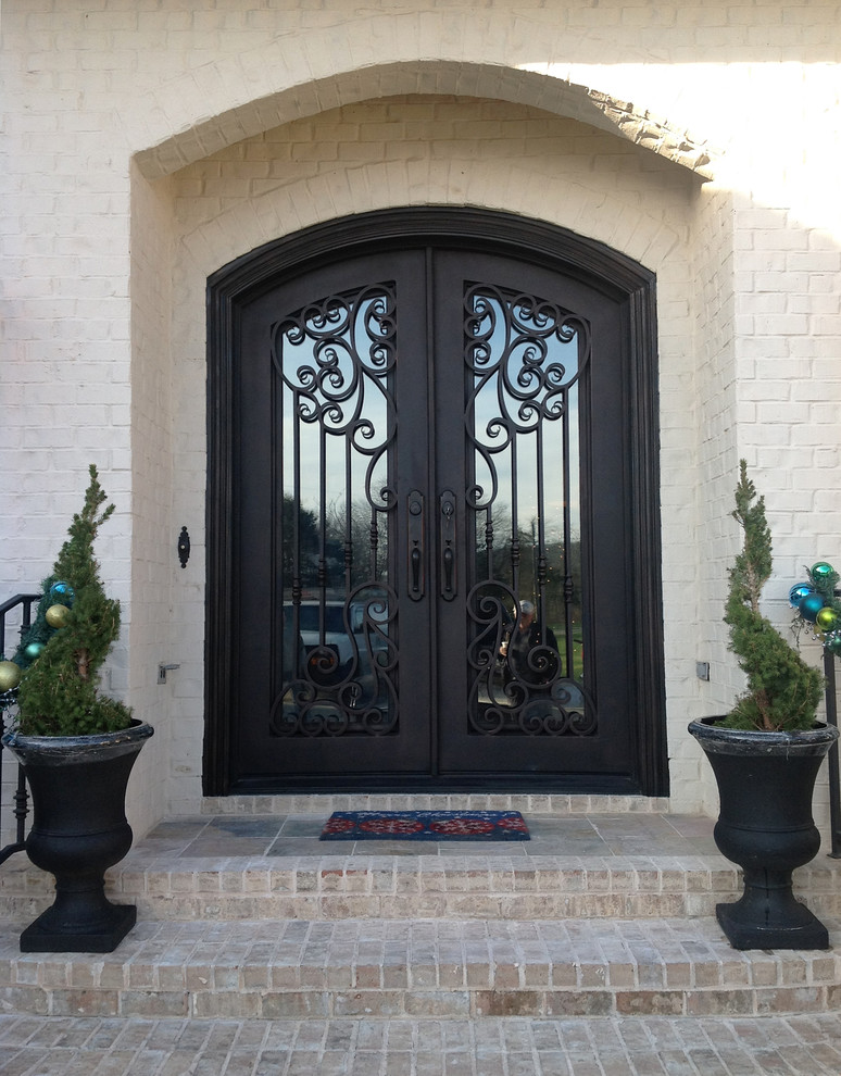 Inspiration for a large transitional front door in Atlanta with a double front door and a metal front door.