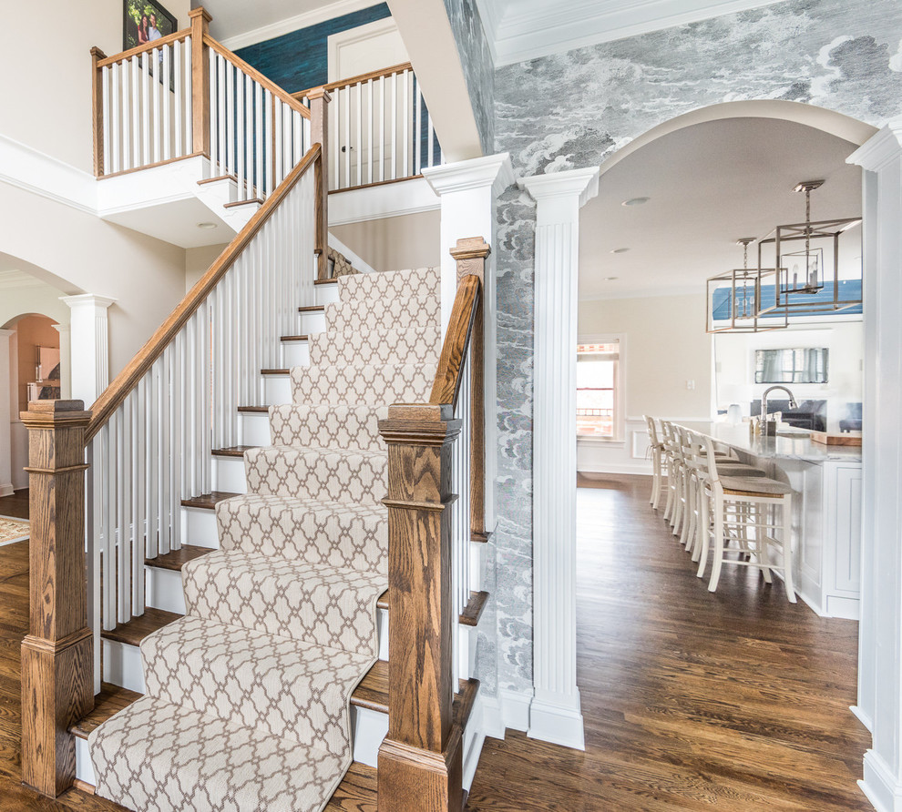 Design ideas for a traditional carpeted l-shaped staircase in Richmond with carpet risers and wood railing.