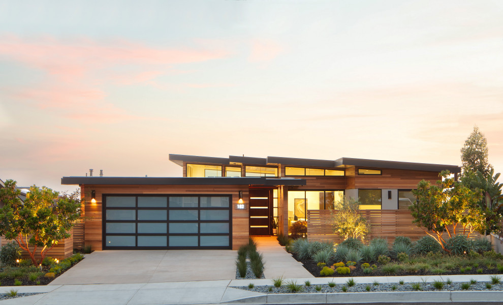 Photo of a contemporary one-storey brown house exterior in San Luis Obispo with wood siding and a shed roof.
