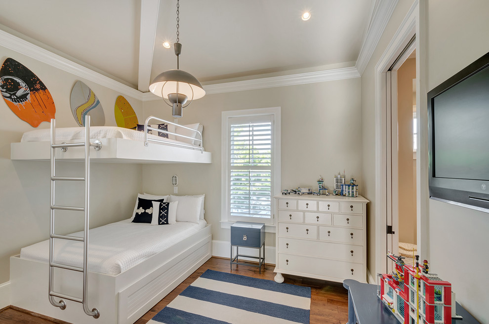 Mid-sized beach style gender-neutral kids' bedroom in Miami with beige walls and medium hardwood floors for kids 4-10 years old.