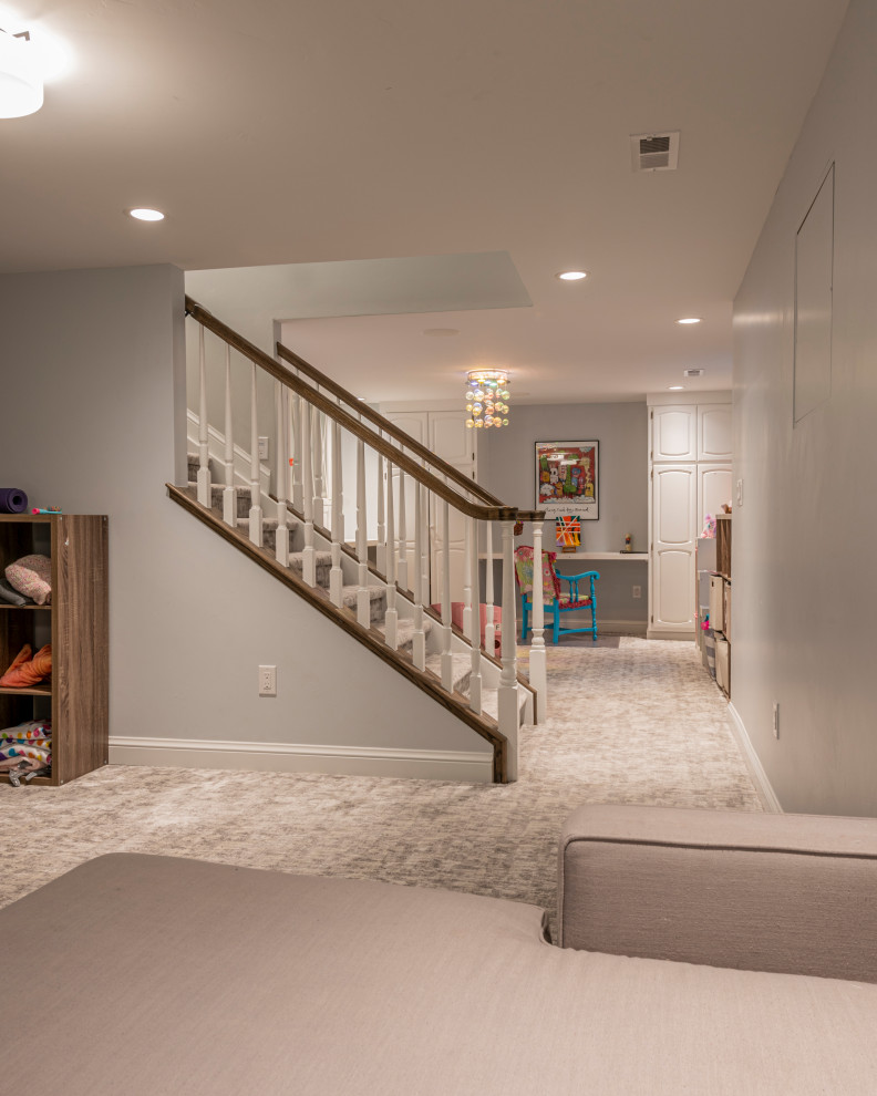 Design ideas for a mid-sized traditional carpeted straight staircase in Denver with carpet risers and wood railing.