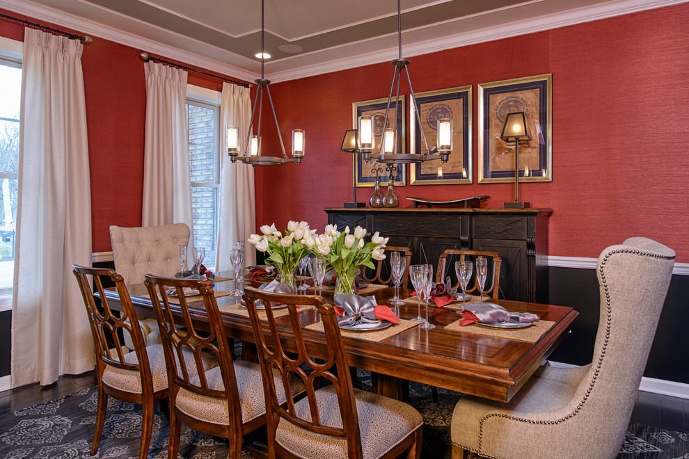 Mid-sized transitional separate dining room in DC Metro with dark hardwood floors, no fireplace and red walls.