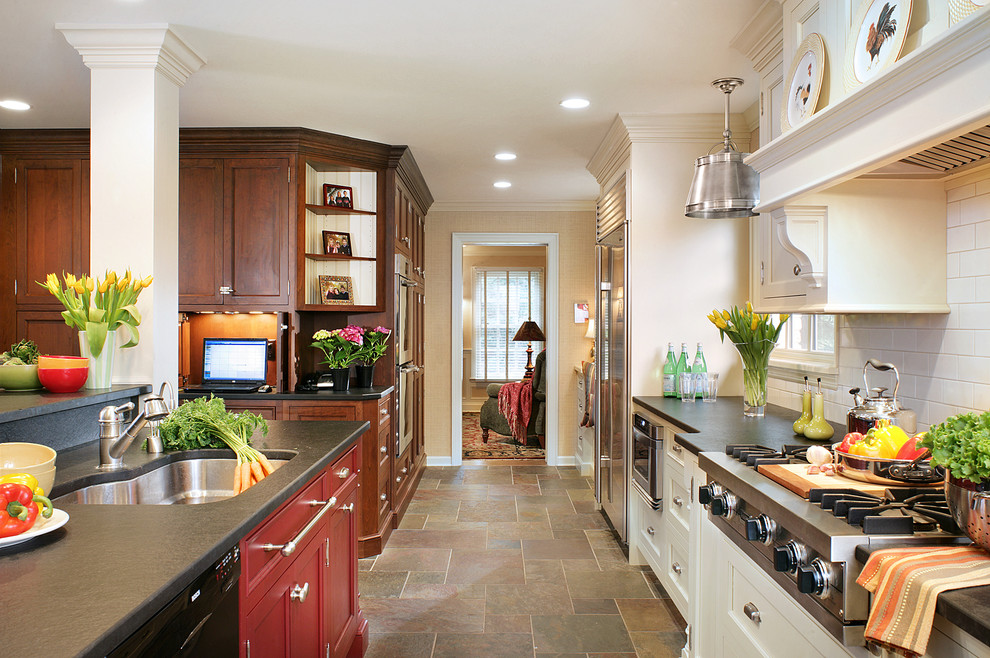 Photo of a traditional kitchen in Newark with subway tile splashback and stainless steel appliances.