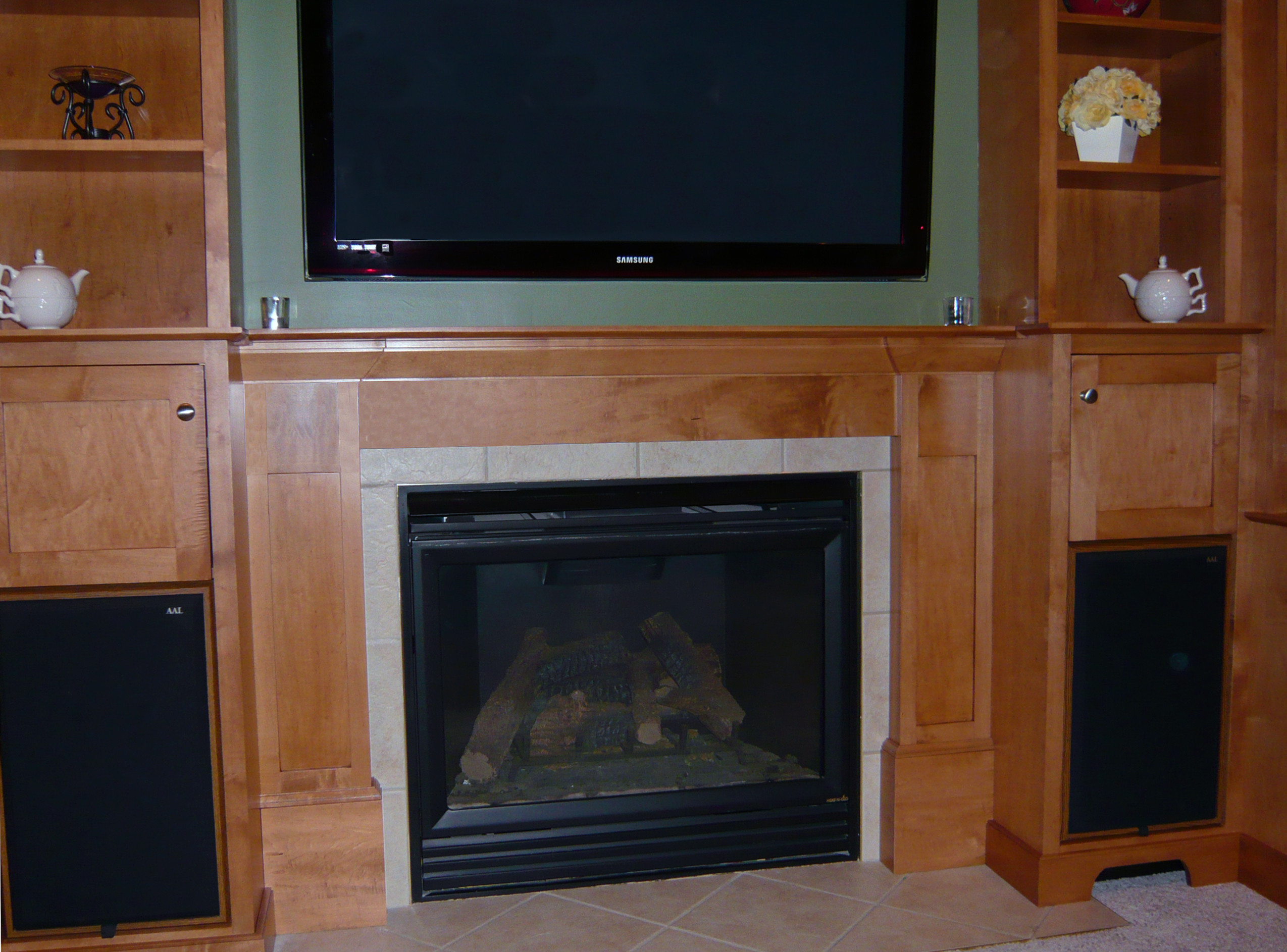 O'Keefe fireplace surround: Shaker style in stained maple.