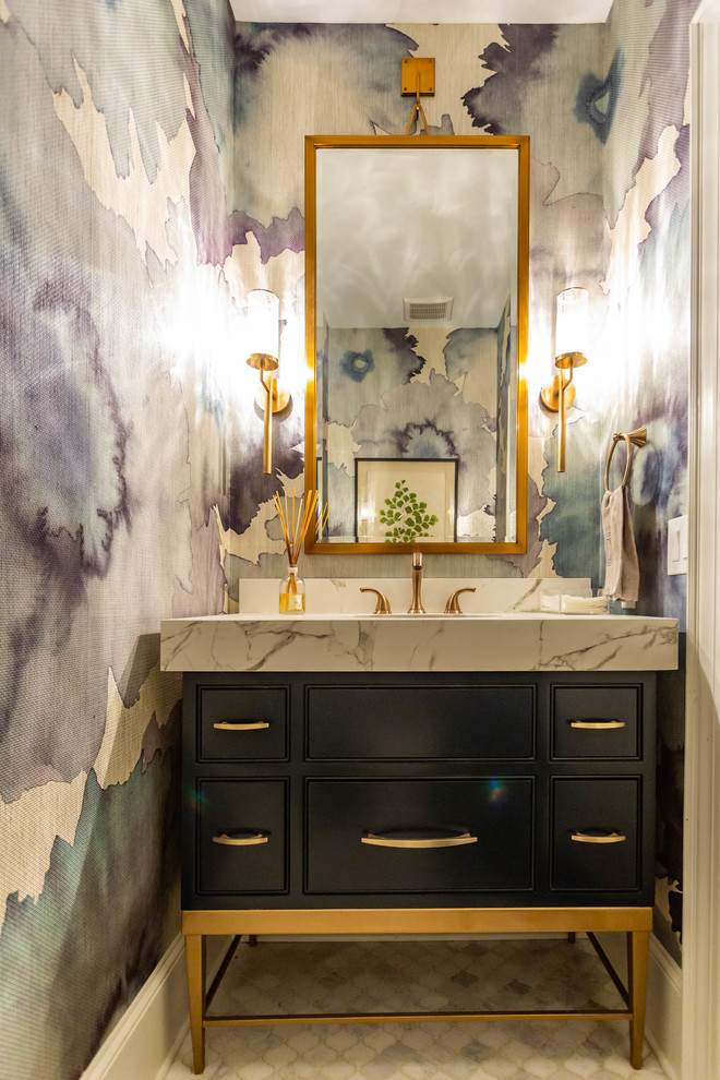 This is an example of a mid-sized transitional powder room in Charlotte with beaded inset cabinets, black cabinets, white floor, white benchtops, multi-coloured walls and marble benchtops.