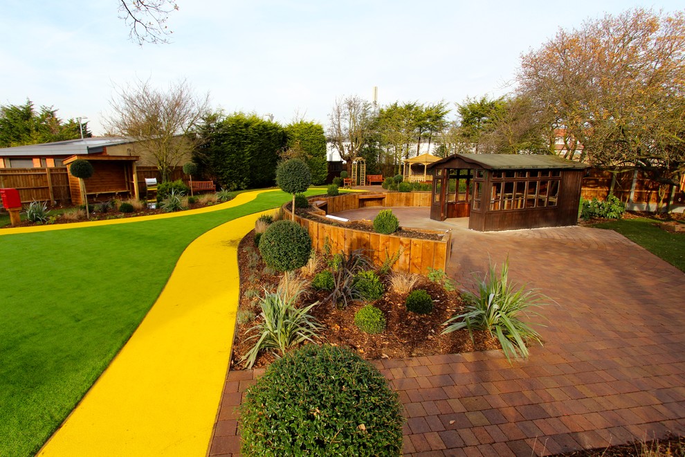 Large contemporary backyard garden in Essex.