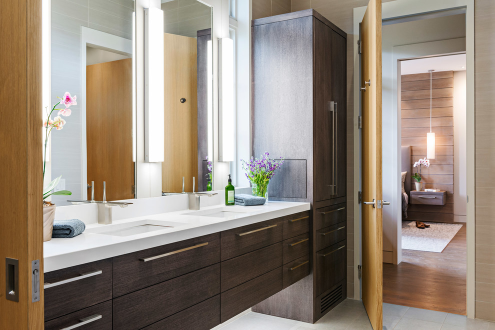 Photo of a large modern master bathroom in Other with flat-panel cabinets, dark wood cabinets, beige tile, beige walls, an undermount sink and grey floor.