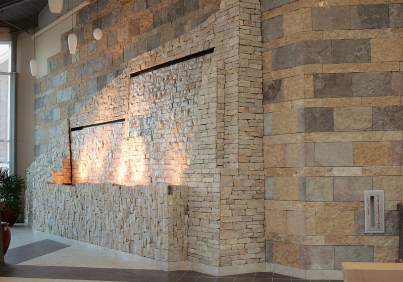 Inspiration for a large ceramic tile entryway remodel with beige walls