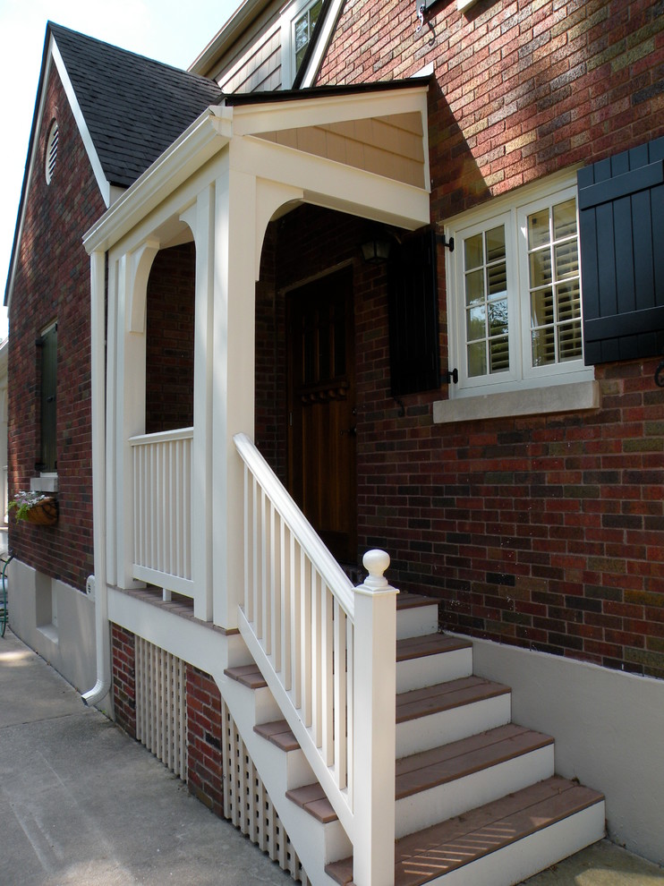 This is an example of a mid-sized traditional backyard verandah in Louisville.