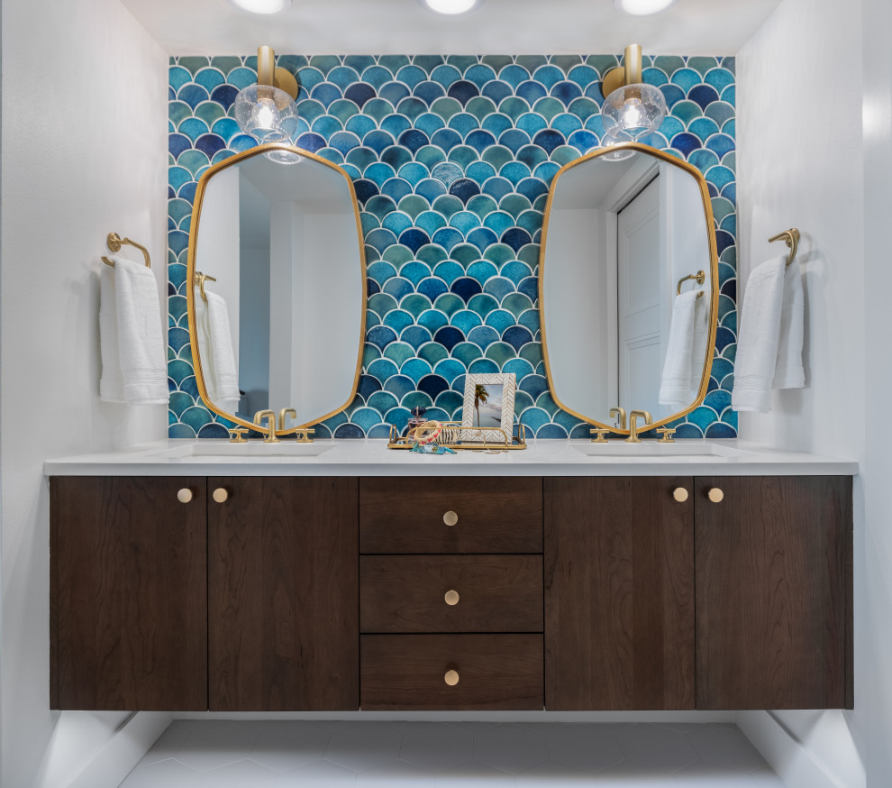 Photo of a large beach style master bathroom in Tampa with flat-panel cabinets, brown cabinets, a double shower, blue tile, ceramic tile, white walls, ceramic floors, a console sink, granite benchtops, white floor, a hinged shower door, white benchtops, a niche, a double vanity, a floating vanity and recessed.