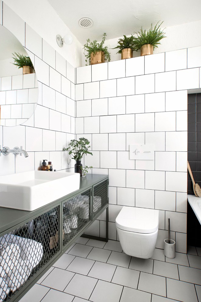 Design ideas for a small industrial bathroom in Saint Petersburg with a wall-mount toilet, white tile, ceramic tile, white walls, ceramic floors, white floor, a vessel sink and green benchtops.