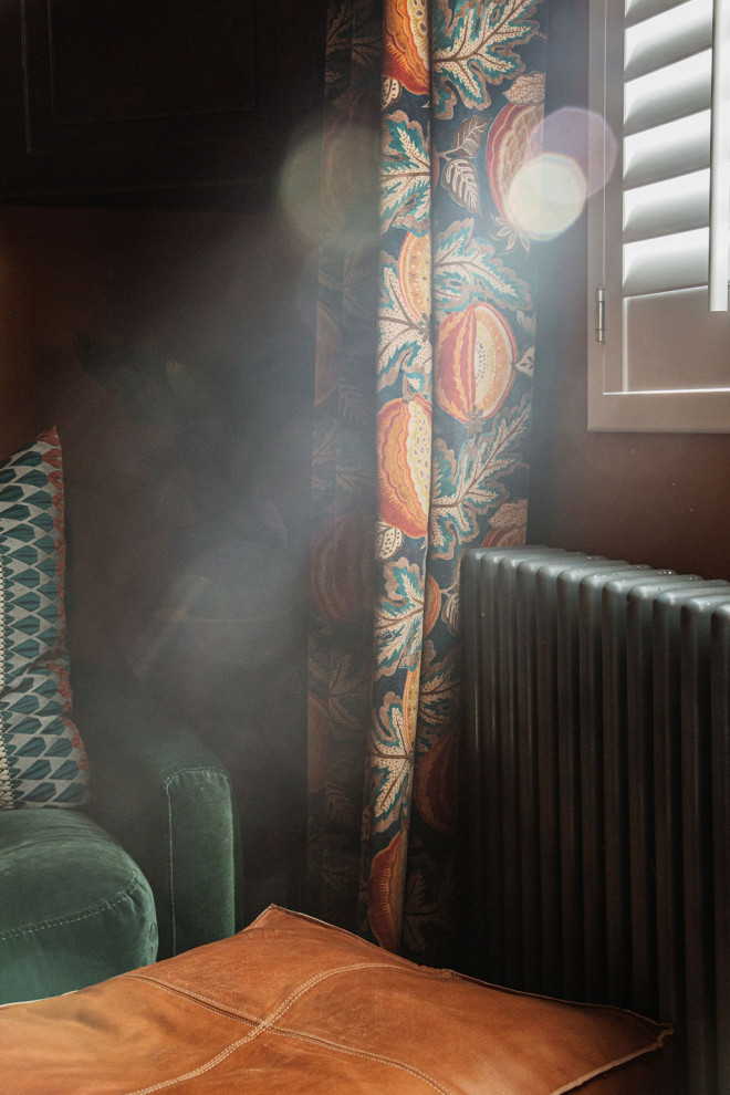 Photo of a bohemian living room curtain in Kent with a tiled fireplace surround, wallpapered walls and curtains.