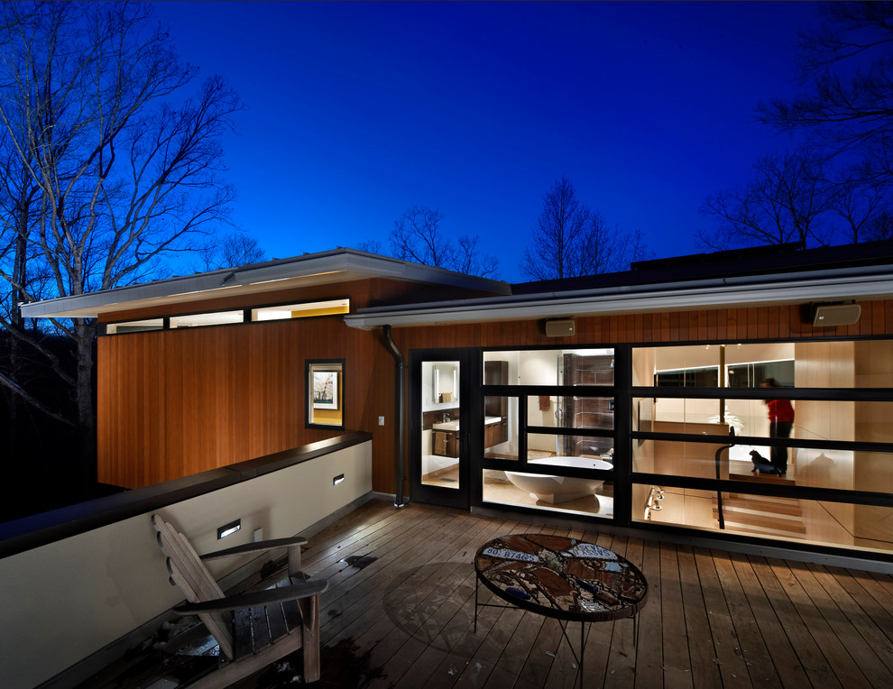 This is an example of a contemporary exterior in Raleigh with wood siding.