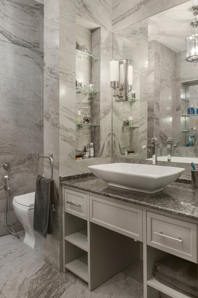 Inspiration for a contemporary master bathroom in Moscow with recessed-panel cabinets, grey cabinets, gray tile, a vessel sink, a wall-mount toilet, porcelain tile, grey benchtops, a single vanity and a freestanding vanity.