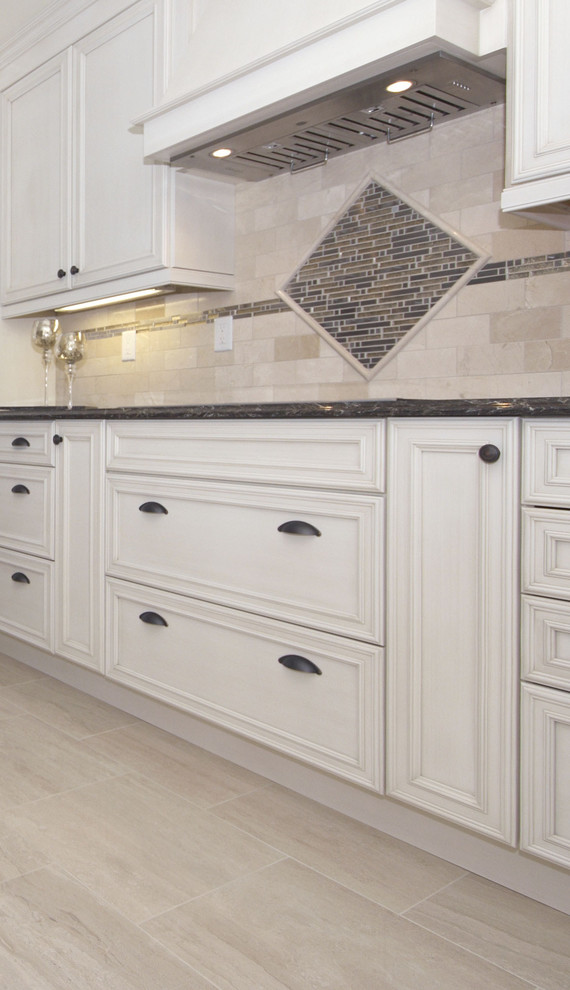 Inspiration for a mid-sized transitional single-wall ceramic tile eat-in kitchen remodel in Toronto with a double-bowl sink, recessed-panel cabinets, beige cabinets, quartz countertops, beige backsplash, subway tile backsplash, stainless steel appliances and a peninsula