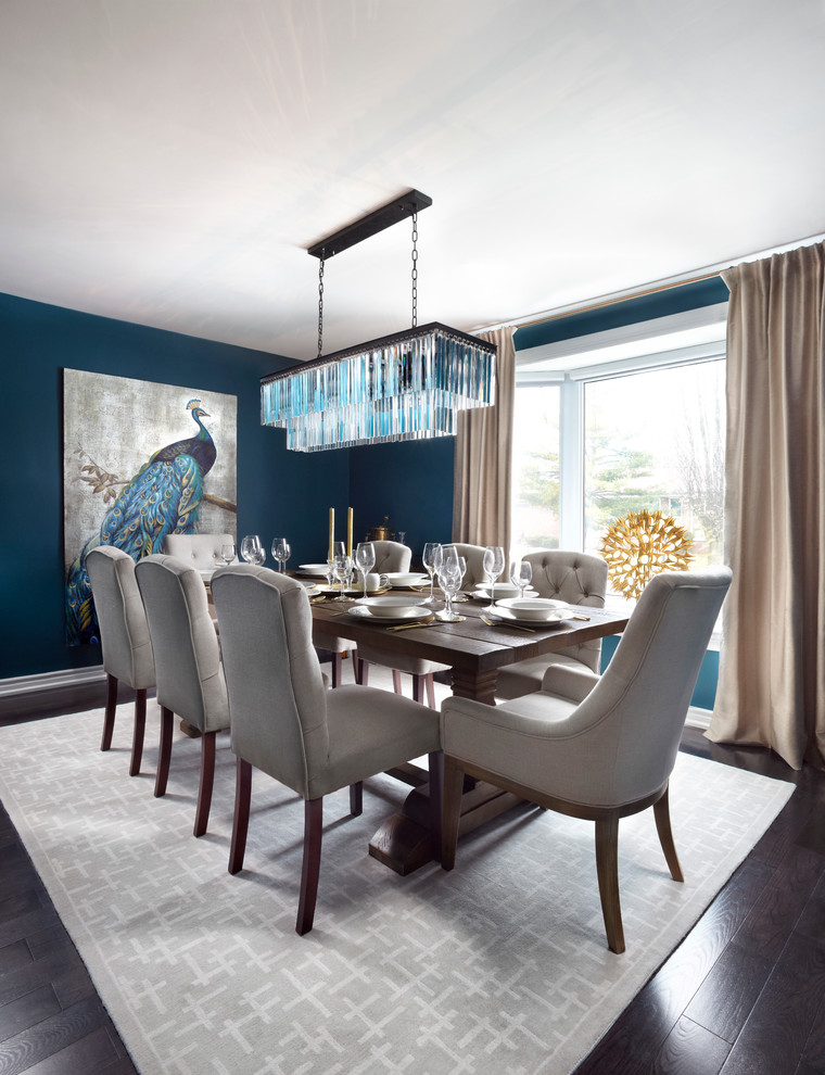 Inspiration for a mid-sized transitional open plan dining in Toronto with blue walls, dark hardwood floors, no fireplace and brown floor.