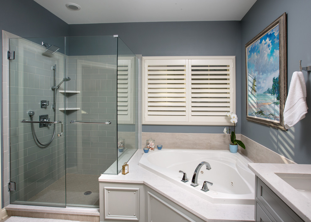 This is an example of a mid-sized modern master bathroom in Columbus with shaker cabinets, grey cabinets, an undermount sink, quartzite benchtops, a corner tub, an open shower, gray tile, ceramic tile, grey walls and ceramic floors.