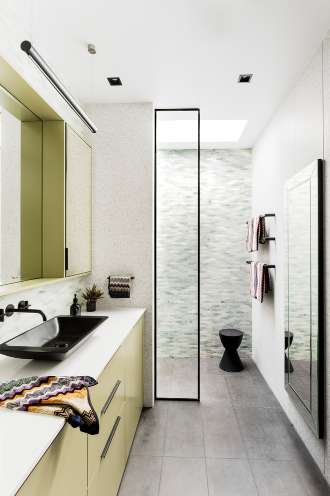 Contemporary bathroom in Melbourne with flat-panel cabinets, green cabinets, a curbless shower, green tile, mosaic tile, white walls, a vessel sink, grey floor, an open shower and white benchtops.