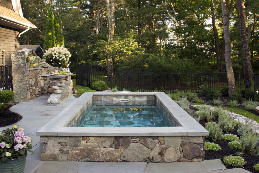 Photo of a small traditional backyard rectangular natural pool in Portland Maine with a hot tub and natural stone pavers.