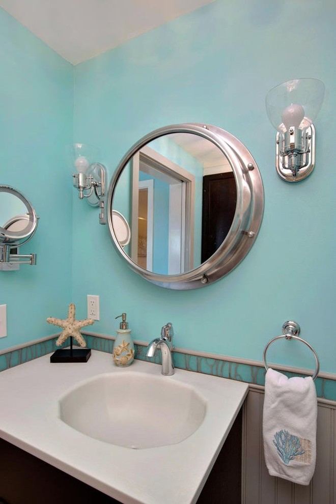 Mid-sized beach style 3/4 bathroom in Portland Maine with shaker cabinets, dark wood cabinets, an open shower, a two-piece toilet, blue tile, green tile, glass tile, green walls, ceramic floors, an integrated sink, solid surface benchtops, beige floor and an open shower.