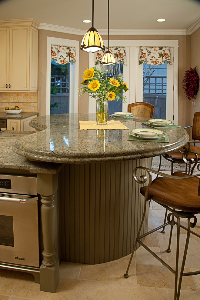 Photo of a traditional galley eat-in kitchen in Seattle with an undermount sink, raised-panel cabinets, yellow cabinets, granite benchtops, yellow splashback and panelled appliances.