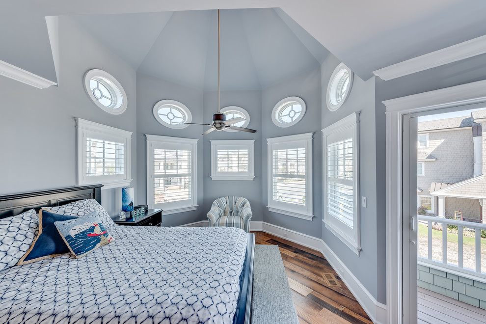 Photo of a mid-sized beach style guest bedroom in Philadelphia with blue walls and medium hardwood floors.