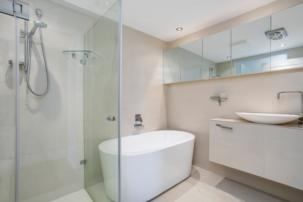 This is an example of a mid-sized contemporary kids bathroom in Sydney with an open shower and an open shower.
