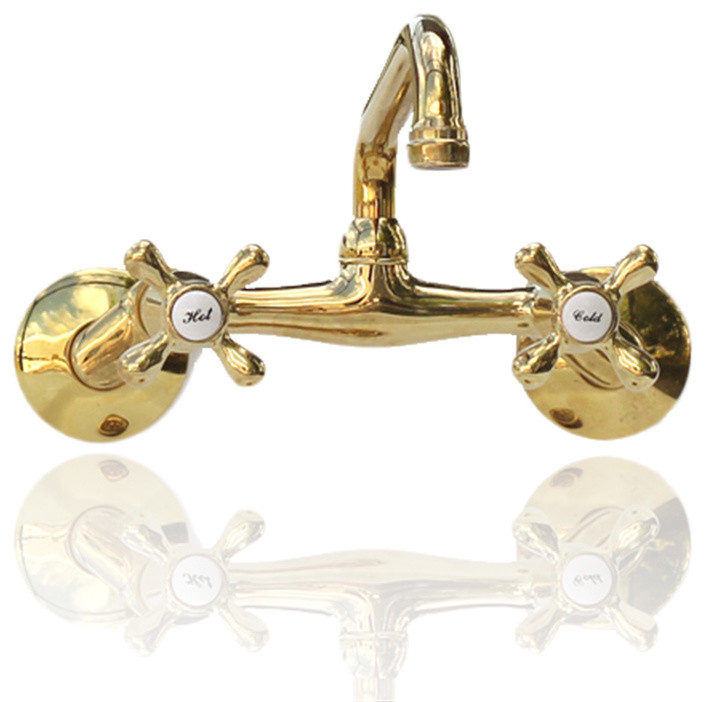 Kingston Brass Wall Mount Polished Brass Faucet Adjustable Centers Cross Handles