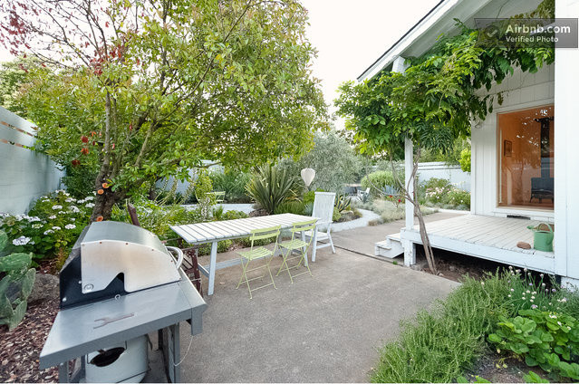 This is an example of a large contemporary backyard patio in San Francisco with gravel.
