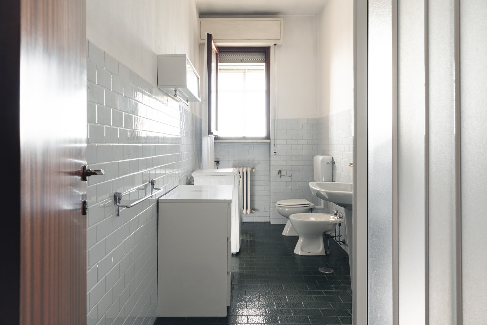 Small modern cloakroom in Florence with flat-panel cabinets, white cabinets, a two-piece toilet, grey tiles, ceramic tiles, white walls, ceramic flooring, a pedestal sink, laminate worktops, green floors, white worktops and a freestanding vanity unit.