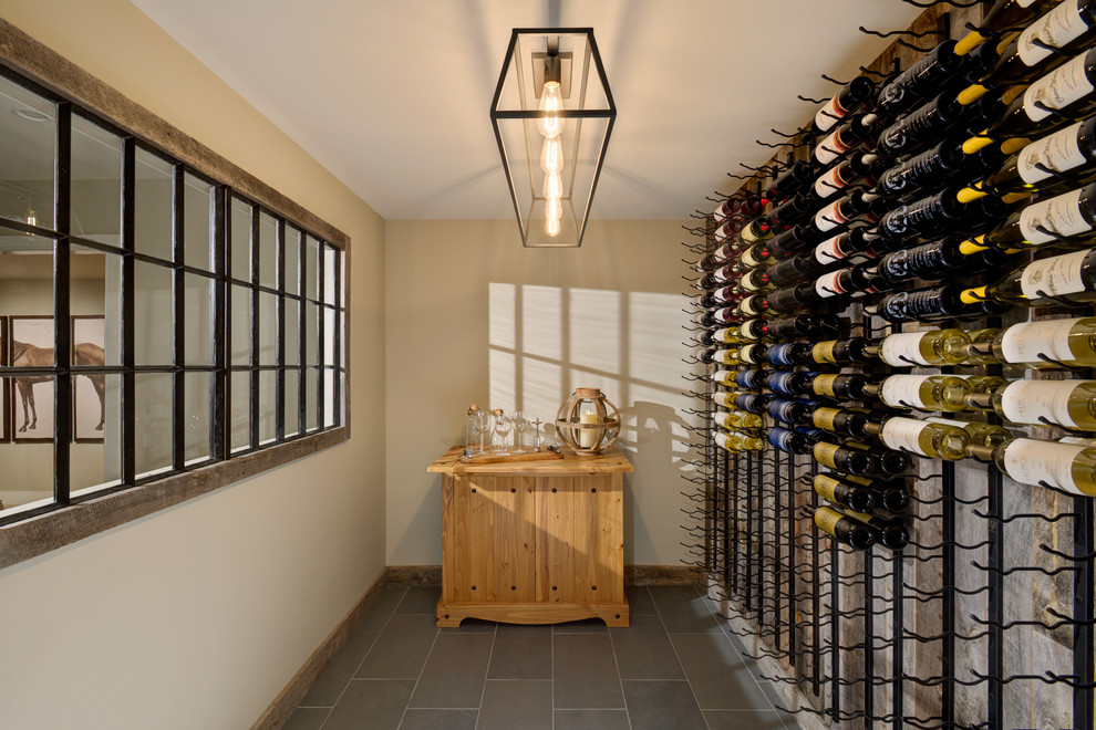 Photo of a transitional wine cellar in New York with storage racks.