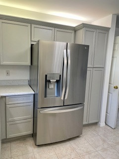 Inspiration for a large u-shaped eat-in kitchen remodel with flat-panel cabinets, gray cabinets, laminate countertops and a peninsula