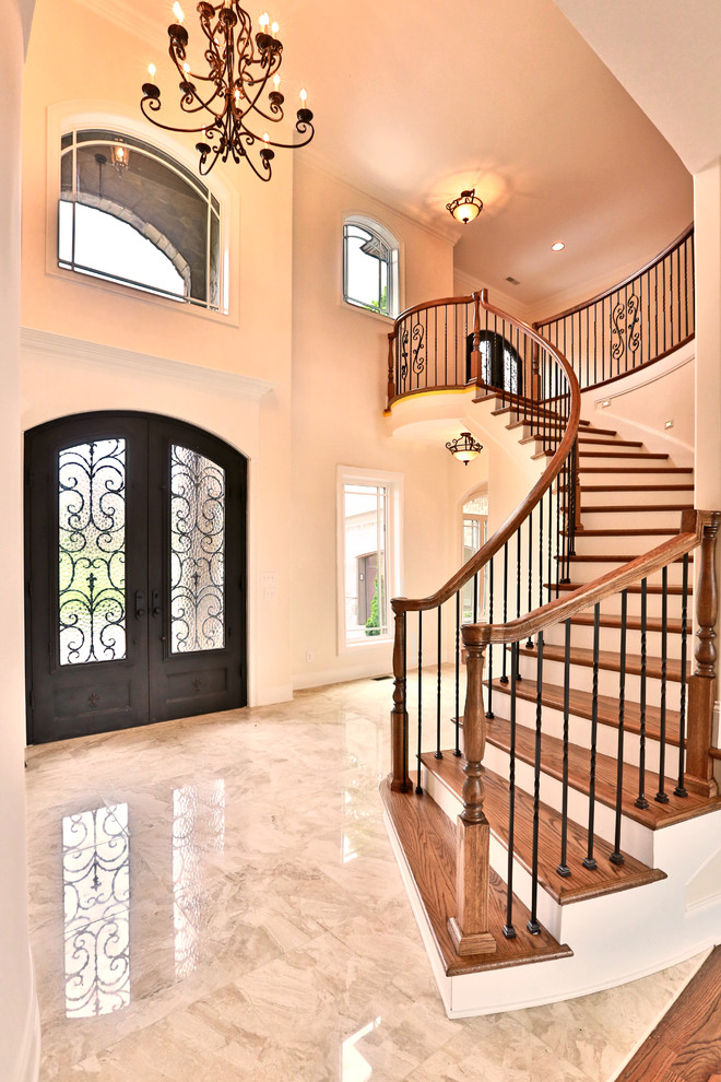 Design ideas for a large traditional foyer in Nashville with white walls, marble floors, a double front door and a metal front door.