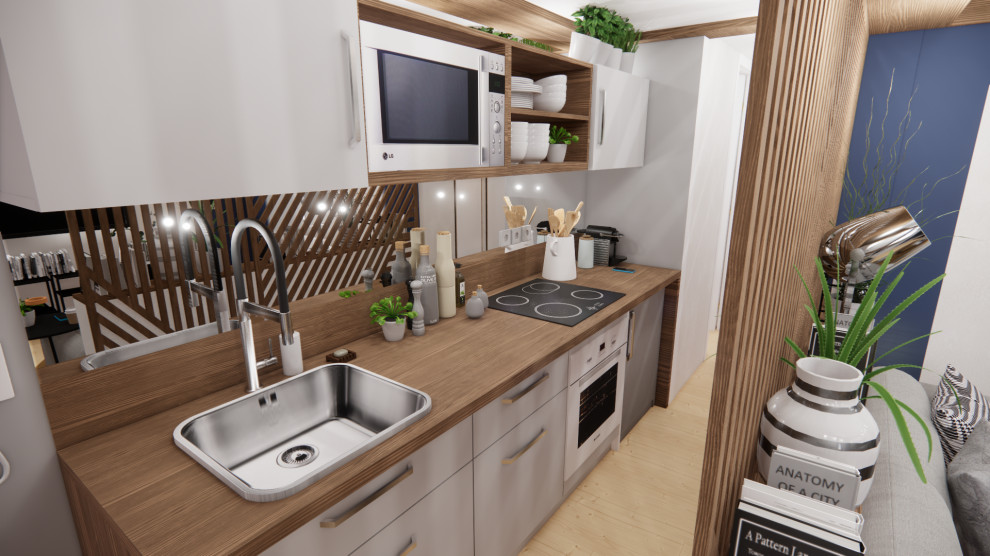 Design ideas for a small eclectic single-wall kitchen in Dijon with an undermount sink, light wood cabinets, wood benchtops, metallic splashback, mirror splashback, panelled appliances, light hardwood floors, no island, beige floor and brown benchtop.