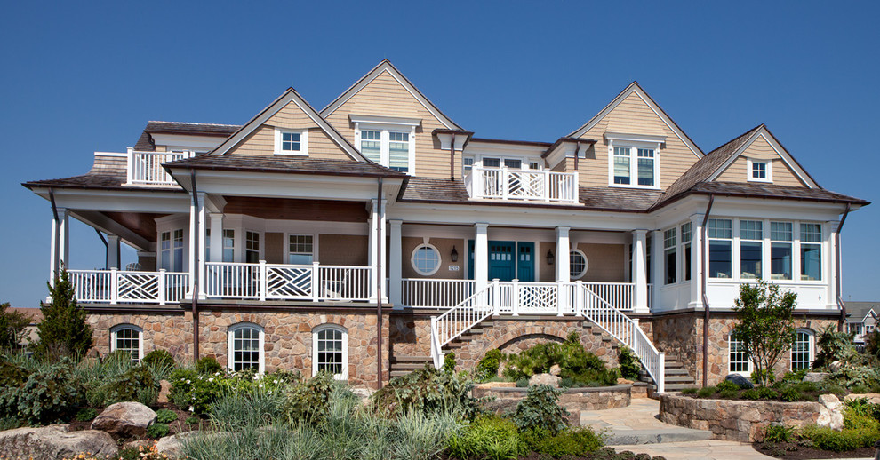 Photo of an expansive traditional three-storey brown exterior in New York with mixed siding.