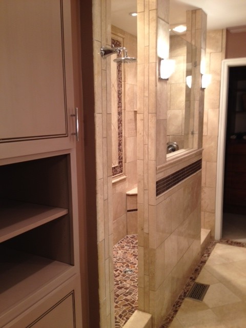 Inspiration for a mid-sized transitional master bathroom in St Louis with a vessel sink, flat-panel cabinets, tile benchtops, an open shower, a one-piece toilet, beige tile, stone tile, purple walls and pebble tile floors.