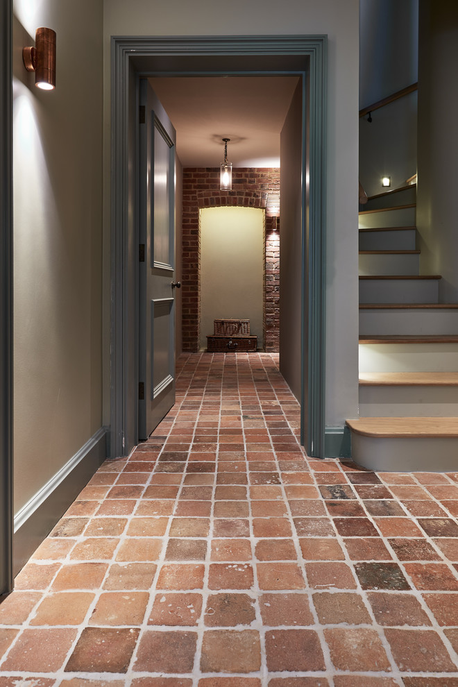 Traditional hallway in Wiltshire with terra-cotta floors.