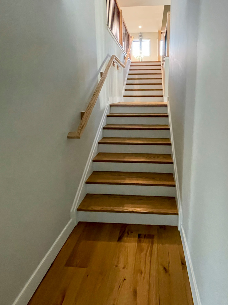 Design ideas for an expansive traditional wood straight mixed railing staircase in DC Metro with wood risers.