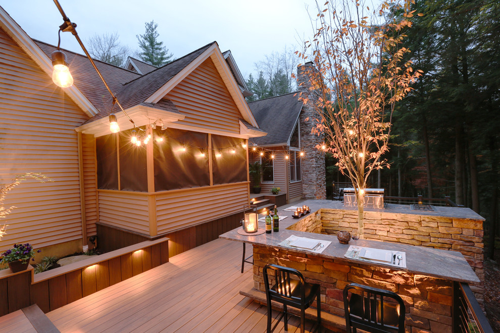 Photo of a mid-sized eclectic backyard deck in Other with an outdoor kitchen and no cover.