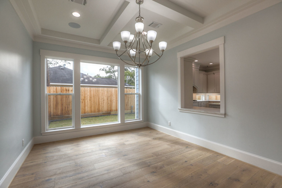Enclosed dining room - large transitional light wood floor and beige floor enclosed dining room idea in Houston with blue walls and no fireplace